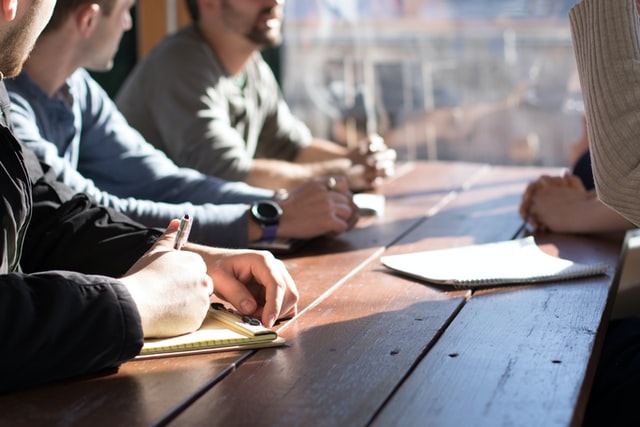 photo of people having meeting- find the right brand name