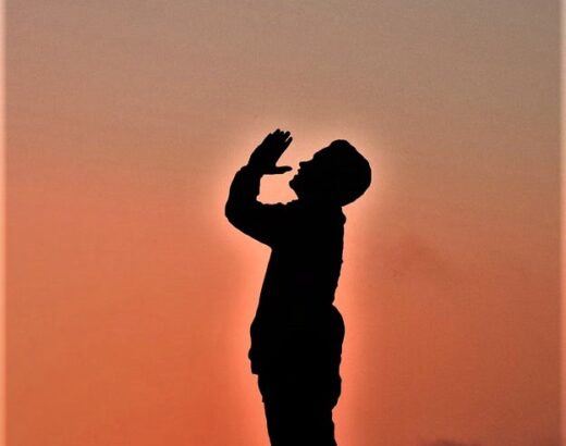 a man standing praying